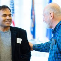 man talks to panelist